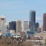 A stunning view of Calgary's skyline featuring the iconic Calgary Tower against a clear sky.