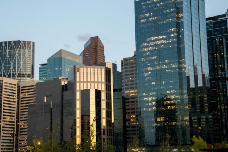 A stunning view of Calgary's modern skyscrapers at dusk, showcasing urban architecture.