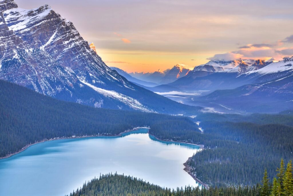 Breathtaking sunrise view of Peyto Lake and the Canadian Rockies in Banff National Park, Alberta.