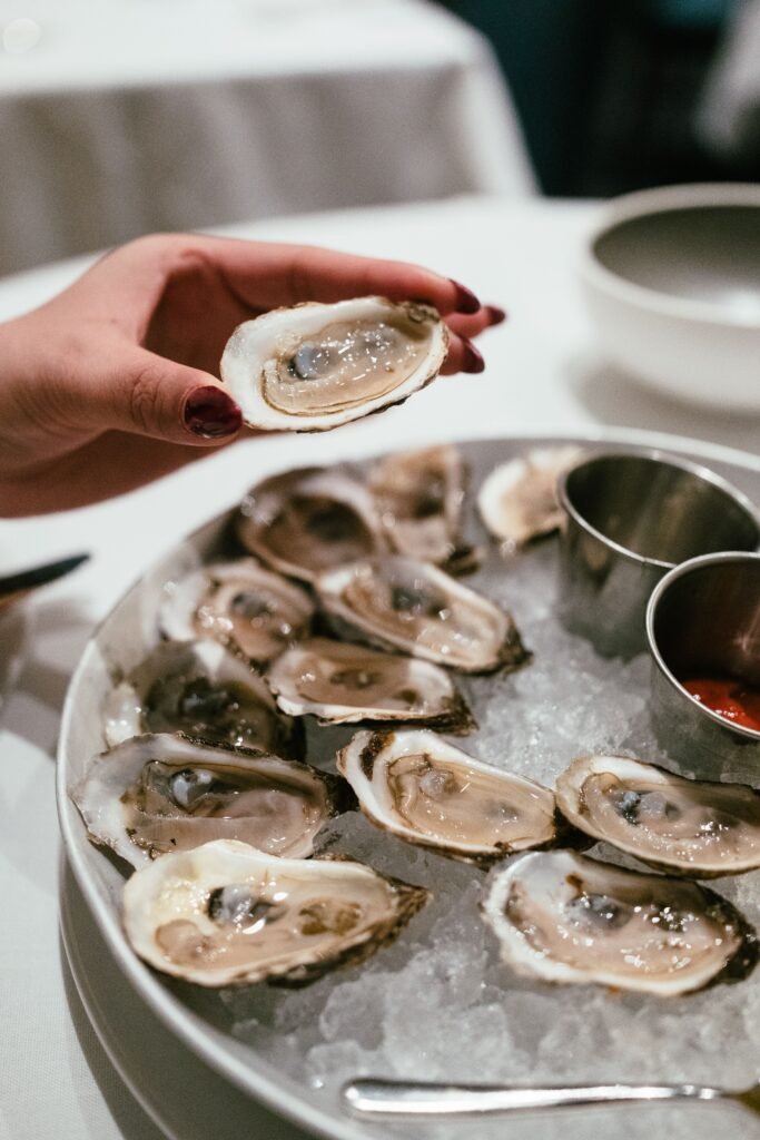 A plate of fresh oysters on ice, ready to eat at a Vancouver restaurant.